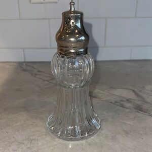 Lady Primrose Dusting Powder glass jar.